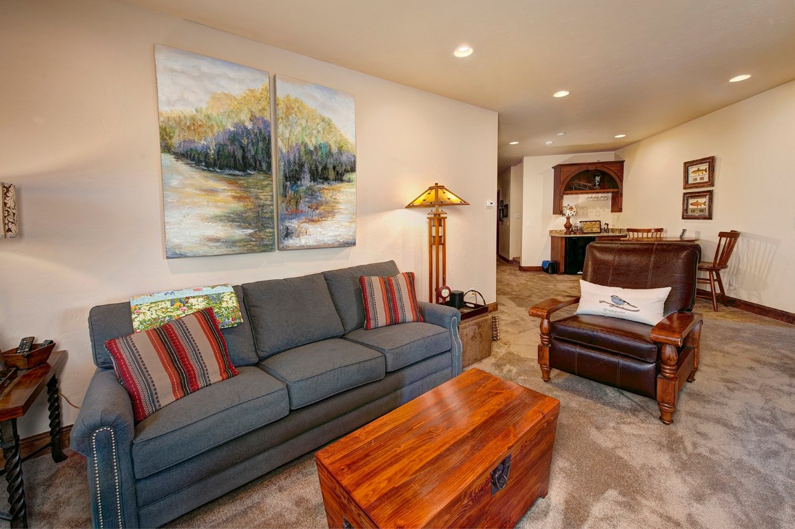 724 Willowbrook Road Silverthorne, CO 80498 - Photo 23 of 30 a living room with furniture and wooden floor