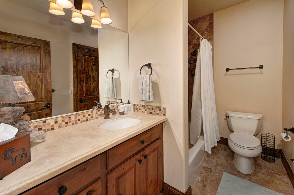 724 Willowbrook Road Silverthorne, CO 80498 - Photo 26 of 30 a bathroom with a sink a toilet and a mirror