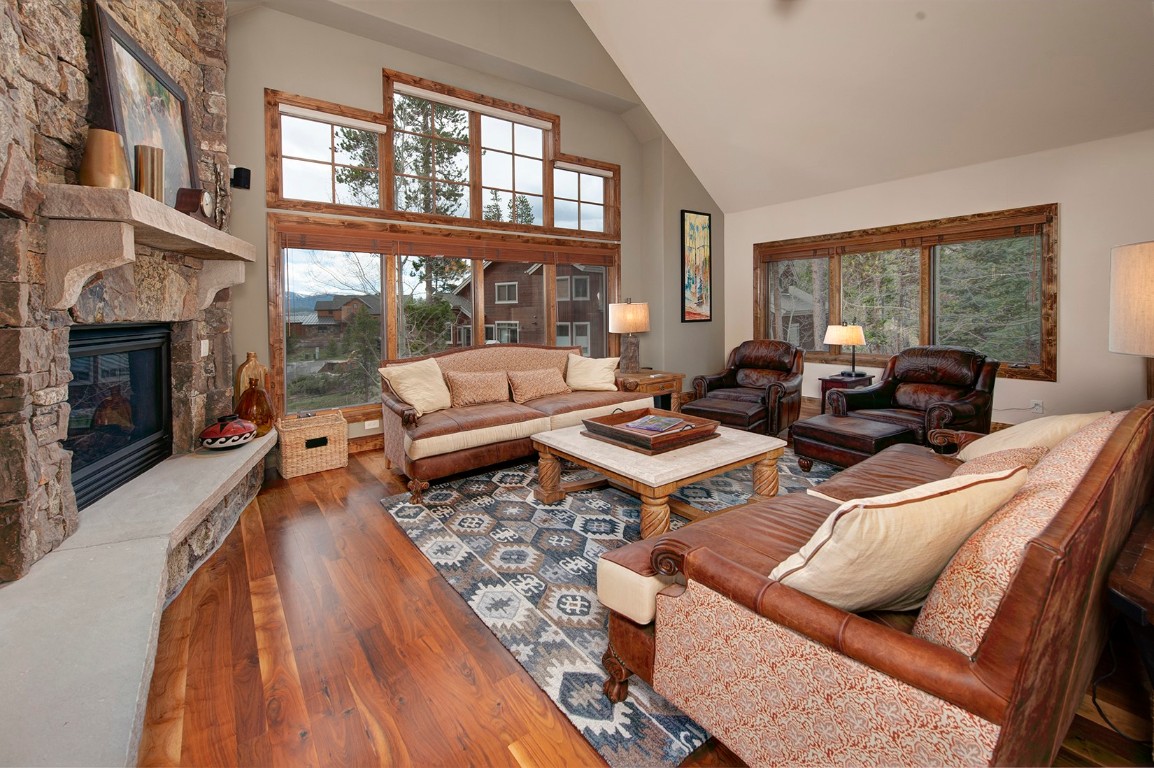 724 Willowbrook Road Silverthorne, CO 80498 - Photo 7 of 30 a living room with furniture fireplace and a large window