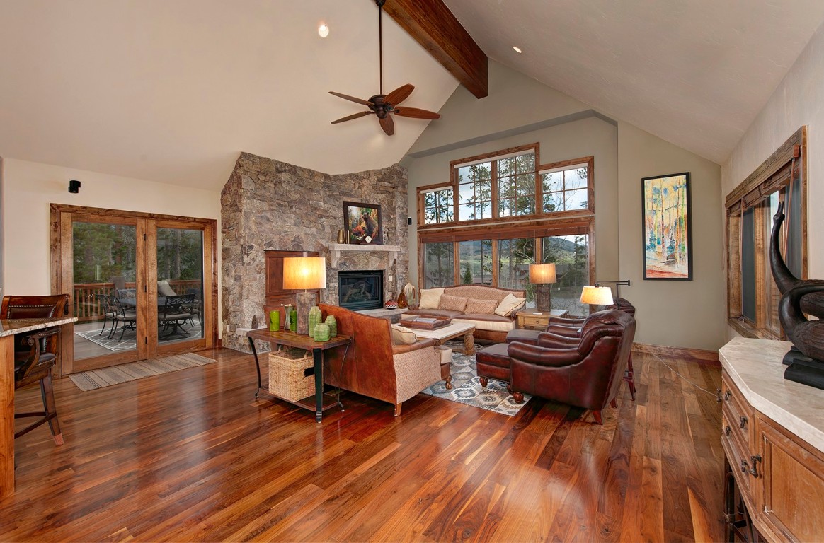 724 Willowbrook Road Silverthorne, CO 80498 - Photo 8 of 30 a living room with furniture a fireplace and a flat screen tv