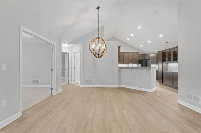 a view of kitchen and wooden floor