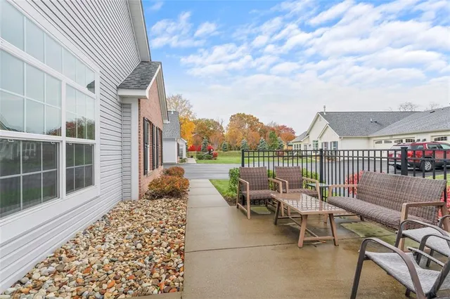 a balcony with with outdoor seating