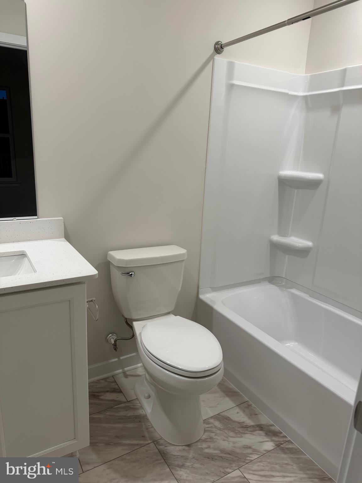 10 Barbine Way Bridgeport, PA 19405 - Photo 23 of 44 a white toilet sitting next to a bath tub