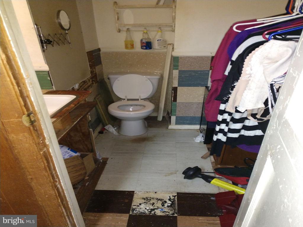 8361 Ridgely Oak Road Baltimore, MD 21234 - Photo 14 of 17 a bathroom with a sink and toilet