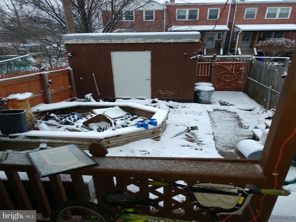 8361 Ridgely Oak Road Baltimore, MD 21234 - Photo 16 of 17 a view of a two chairs and a table in a backyard