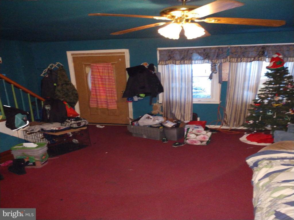 8361 Ridgely Oak Road Baltimore, MD 21234 - Photo 3 of 17 a living room with furniture and a chandelier