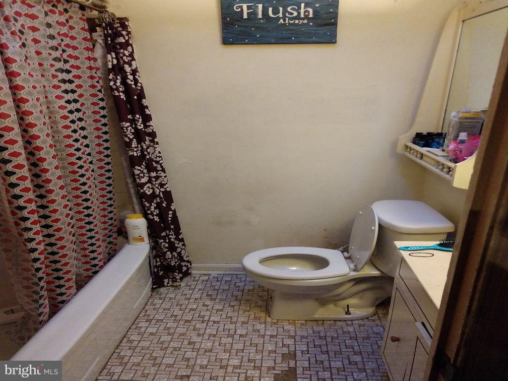 8361 Ridgely Oak Road Baltimore, MD 21234 - Photo 10 of 17 a bathroom with a toilet and a shower