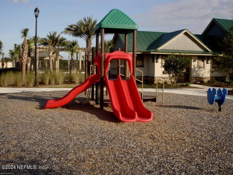 1108 Nochaway Drive St. Augustine, FL 32092 - Photo 11 of 11 a view of a park with slide and a table