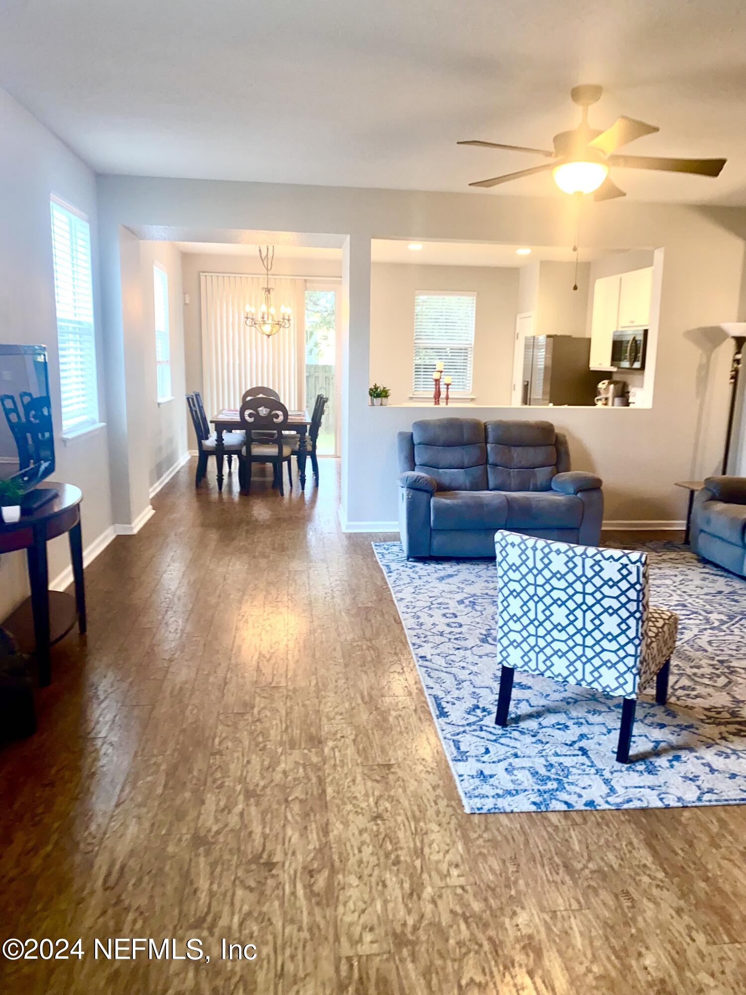 1108 Nochaway Drive St. Augustine, FL 32092 - Photo 3 of 11 a living room with furniture and a large window