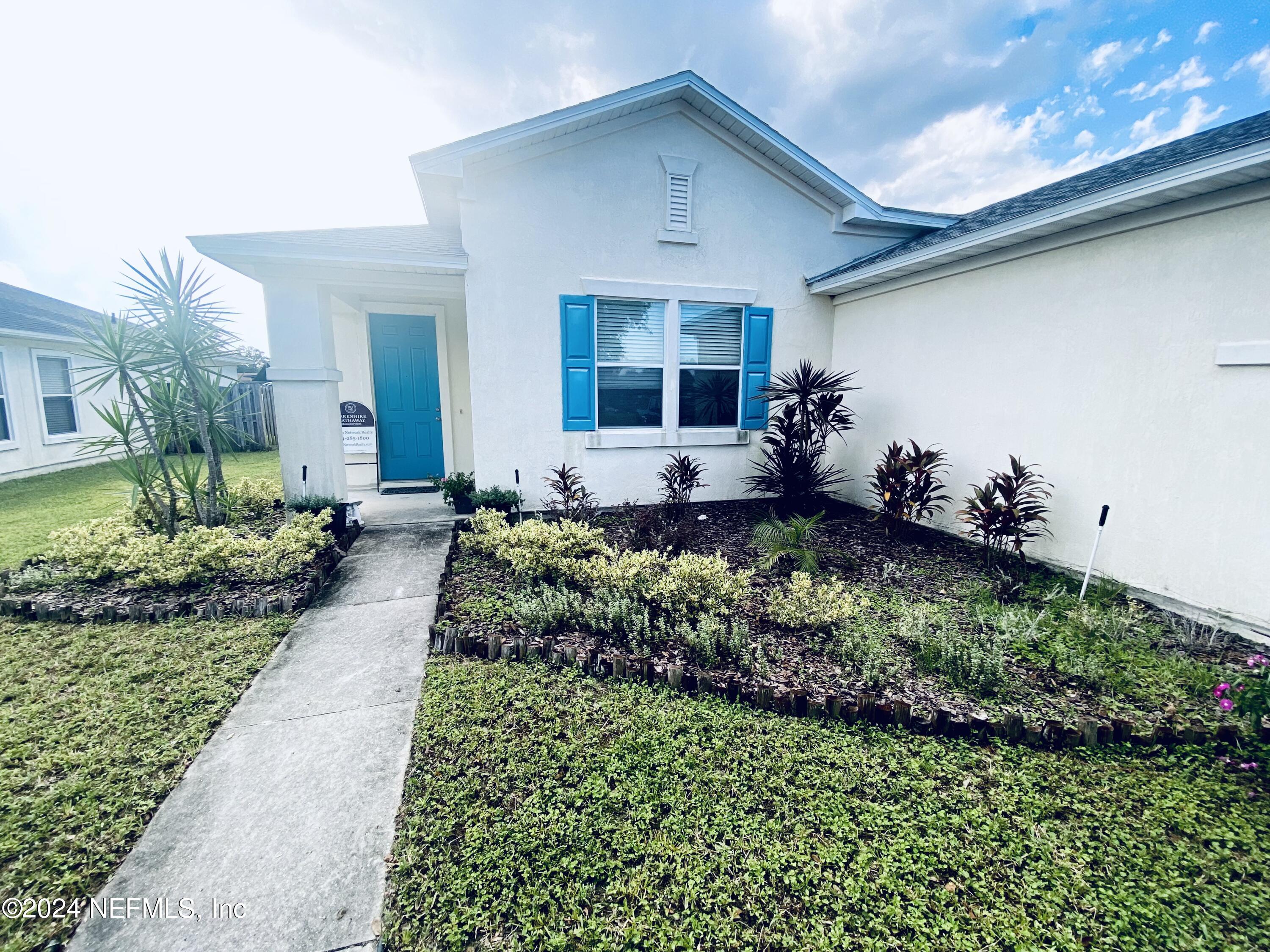 1108 Nochaway Drive St. Augustine, FL 32092 - Photo 10 of 11 a front view of a house with a yard