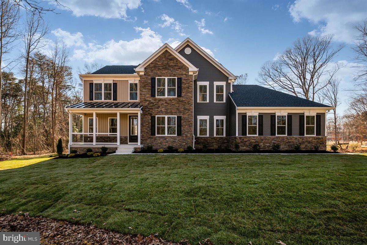 77 Magothy Beach Road Pasadena, MD 21122 - Photo 2 of 44 Stone Front, Metal Roof and Hip Roof above Garage