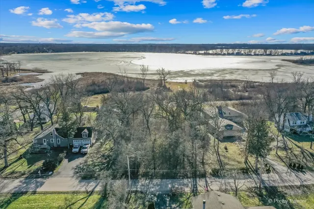 a view of a swimming pool with a yard