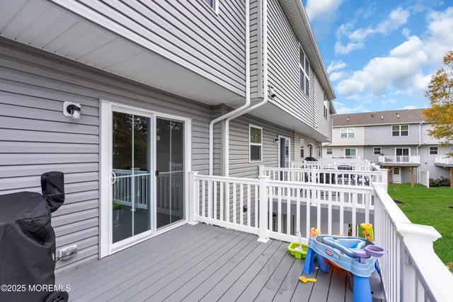 a view of a chair and table in the balcony