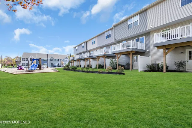 a view of a house with a big yard