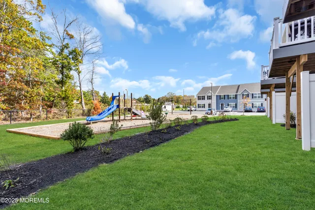 a view of a park with swings and slides