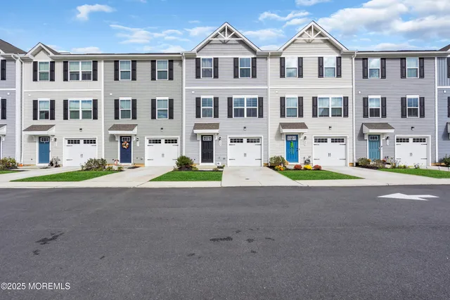 a view of multiple house with a yard
