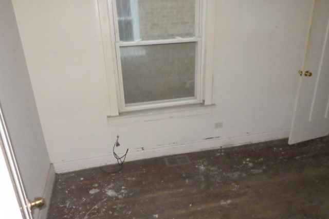 524 East 90th Street Chicago, IL 60619 - Photo 8 of 15 an empty room with a window