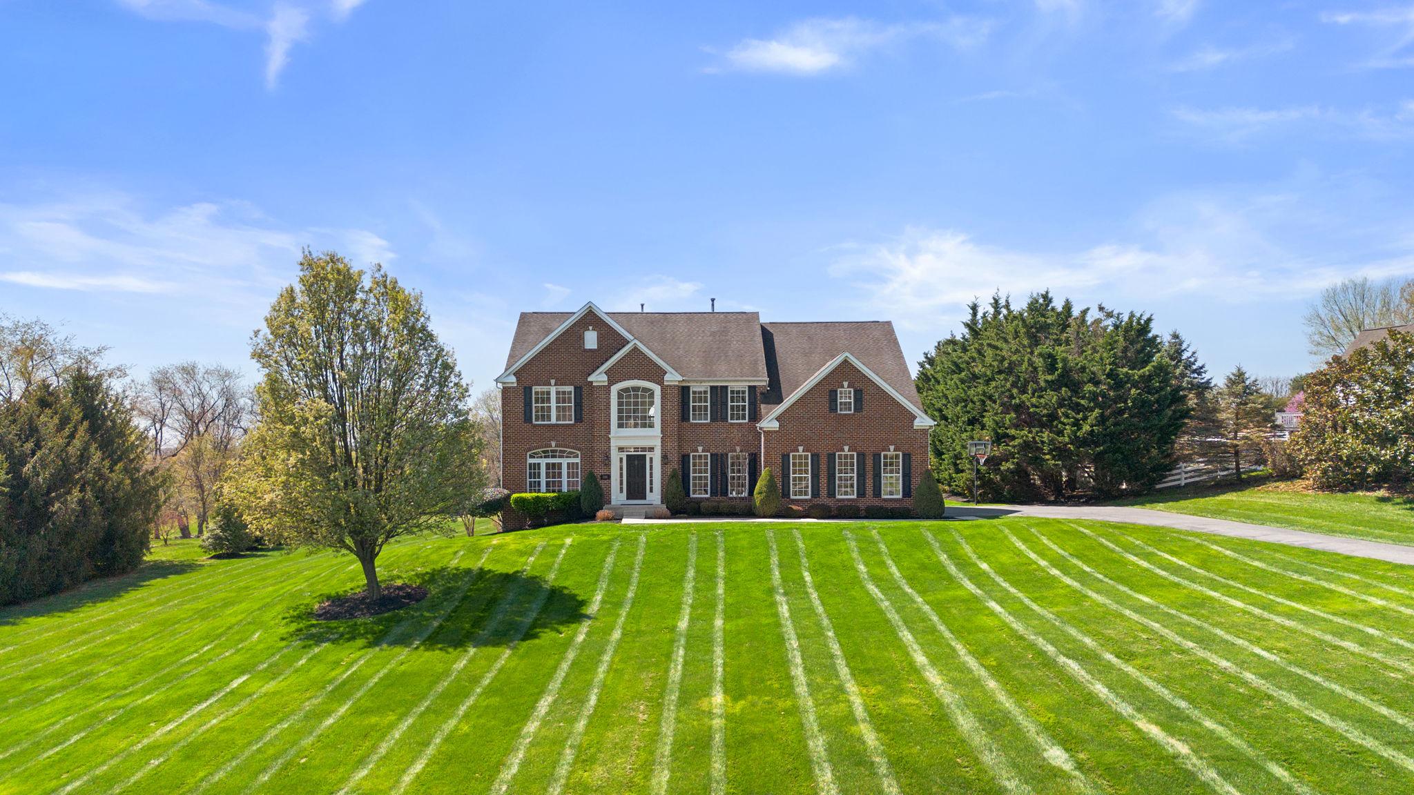 3088 Ballesteras Court Mount Airy, MD 21771 - Photo 1 of 64 a front view of a house with yard