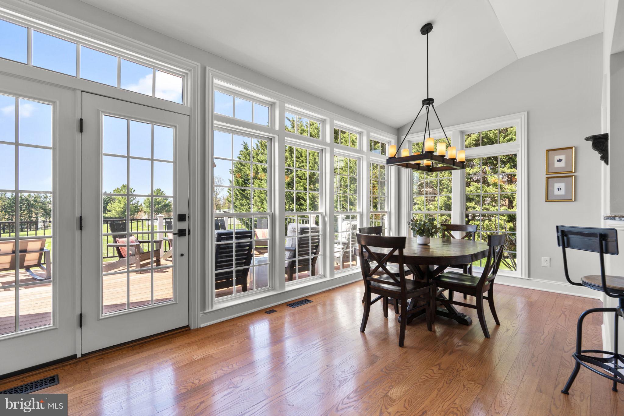 3088 Ballesteras Court Mount Airy, MD 21771 - Photo 14 of 64 a view of a dining room with furniture window and wooden floor