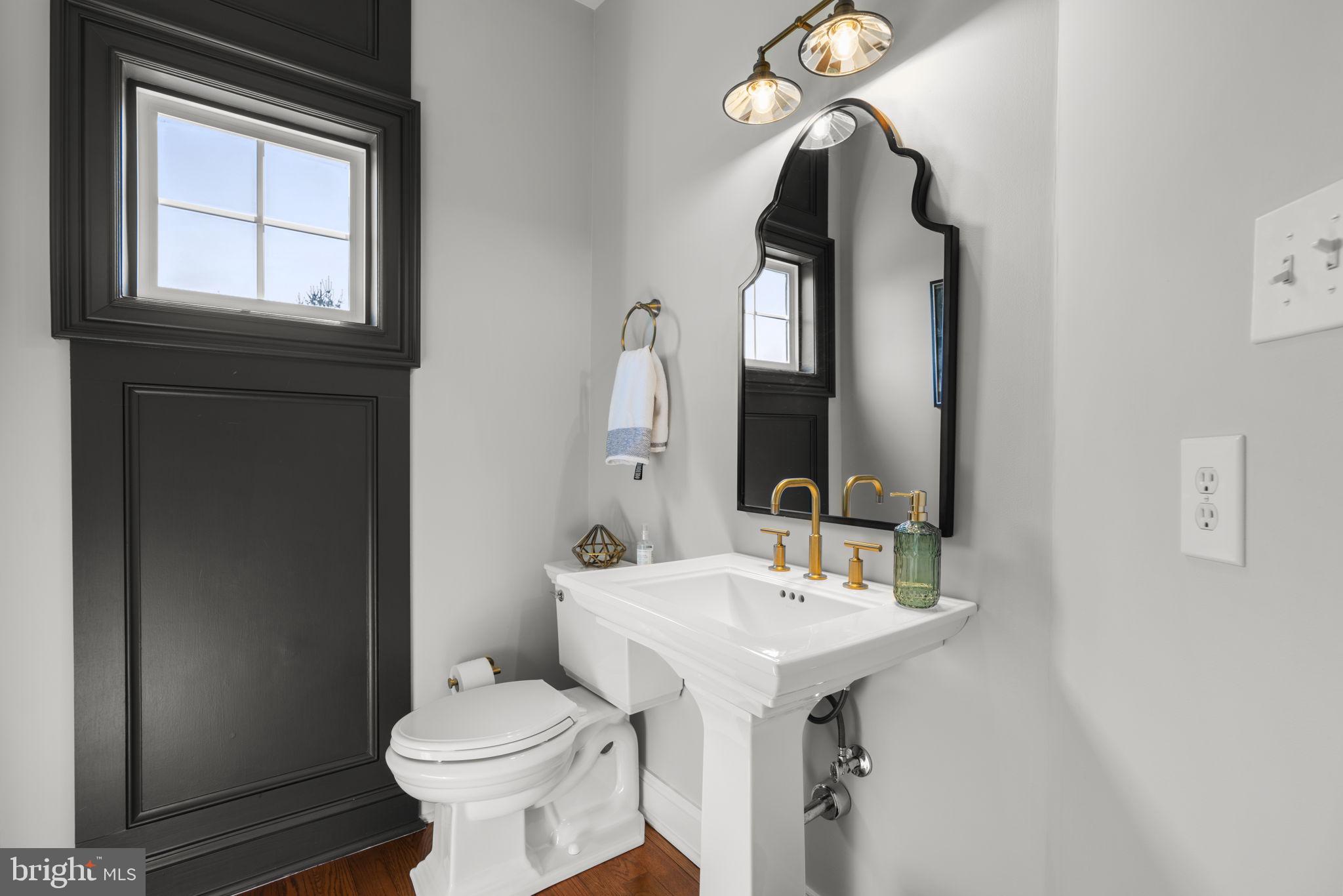 3088 Ballesteras Court Mount Airy, MD 21771 - Photo 21 of 64 a bathroom with a toilet sink and mirror