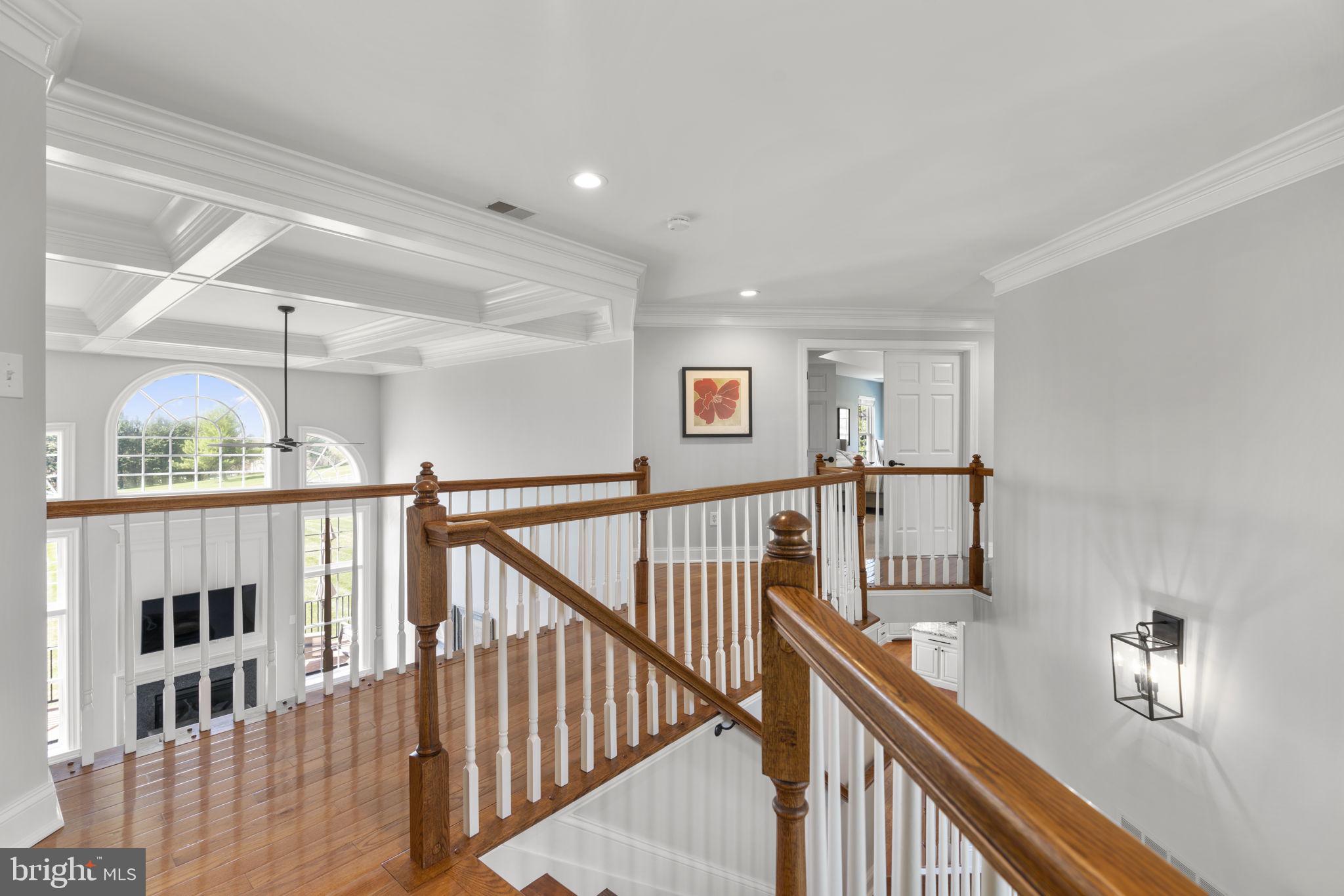 3088 Ballesteras Court Mount Airy, MD 21771 - Photo 24 of 64 a view of staircase with lots of frames on wall and windows