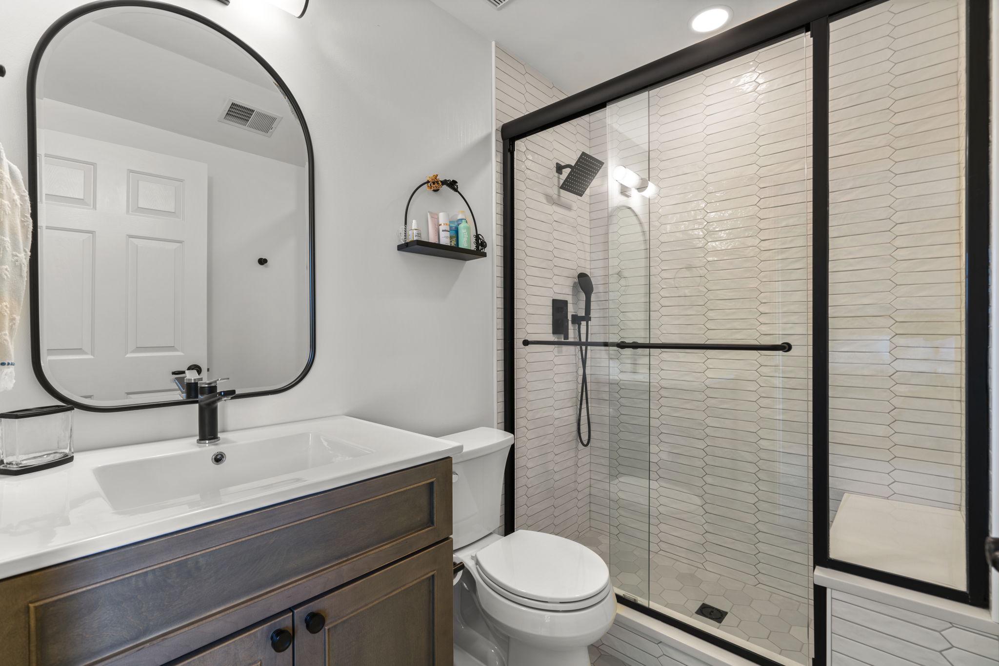3088 Ballesteras Court Mount Airy, MD 21771 - Photo 34 of 64 a bathroom with a toilet sink and mirror