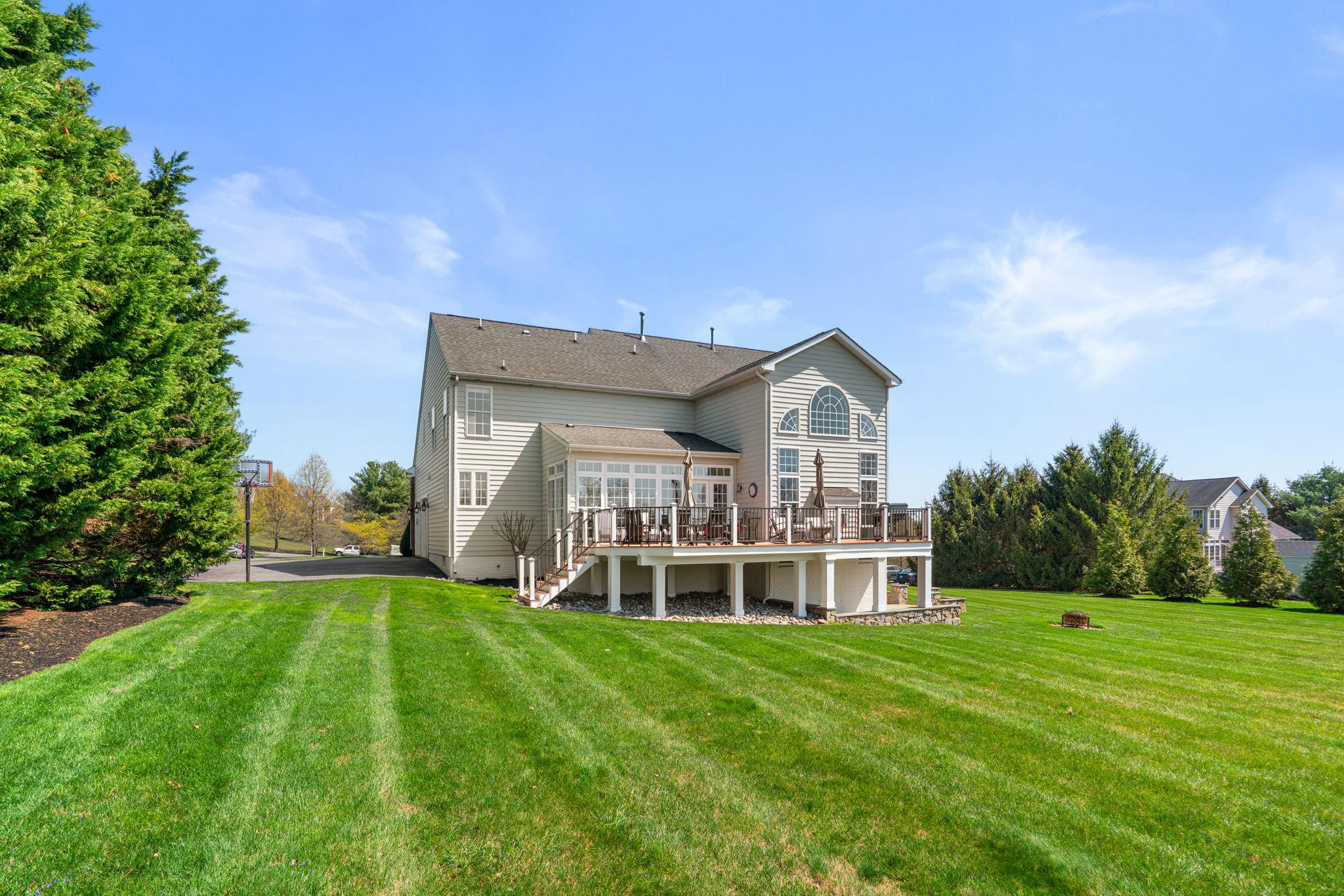 3088 Ballesteras Court Mount Airy, MD 21771 - Photo 58 of 64 a view of a house with a big yard and large trees