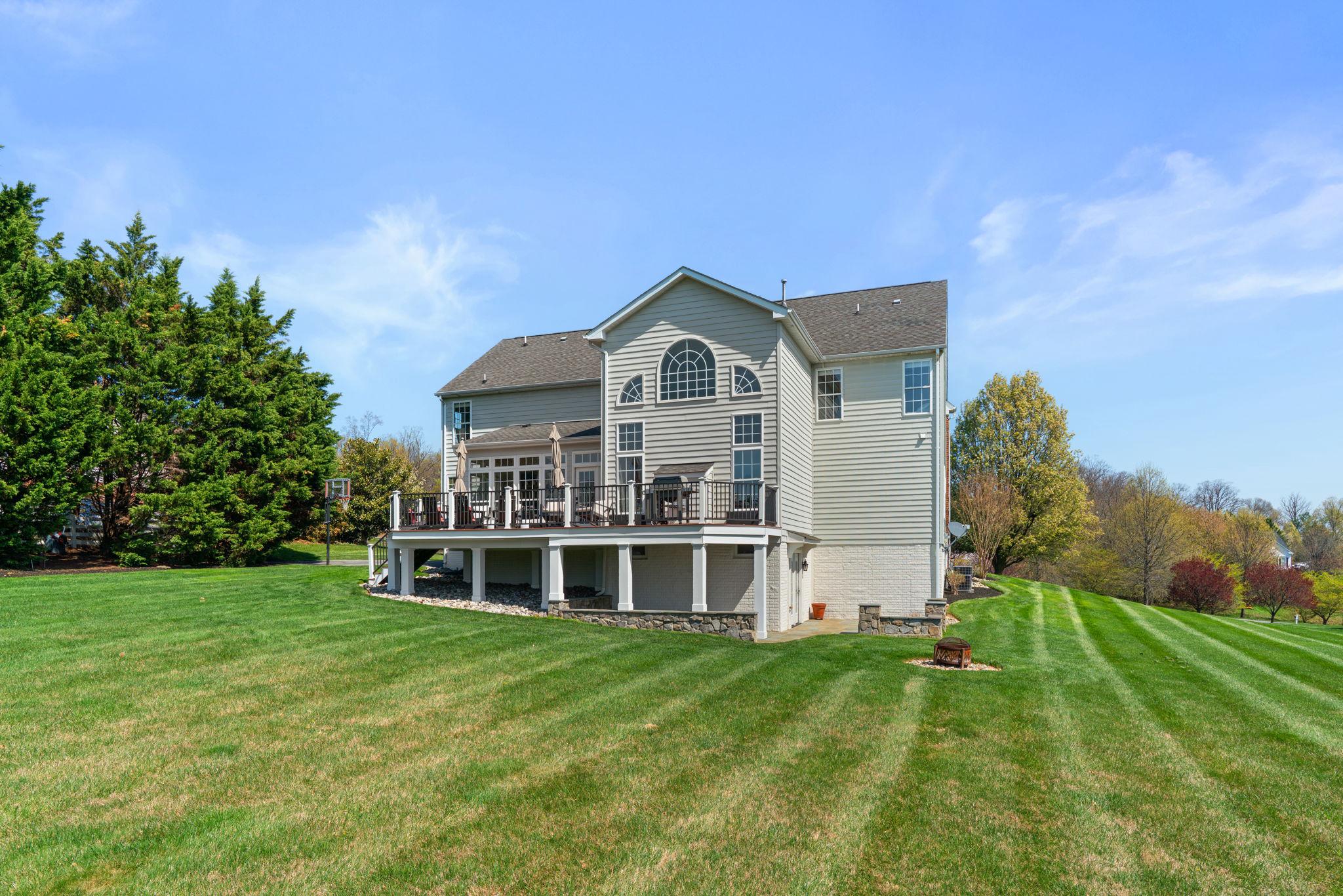 3088 Ballesteras Court Mount Airy, MD 21771 - Photo 59 of 64 a view of a house with a big yard and large trees