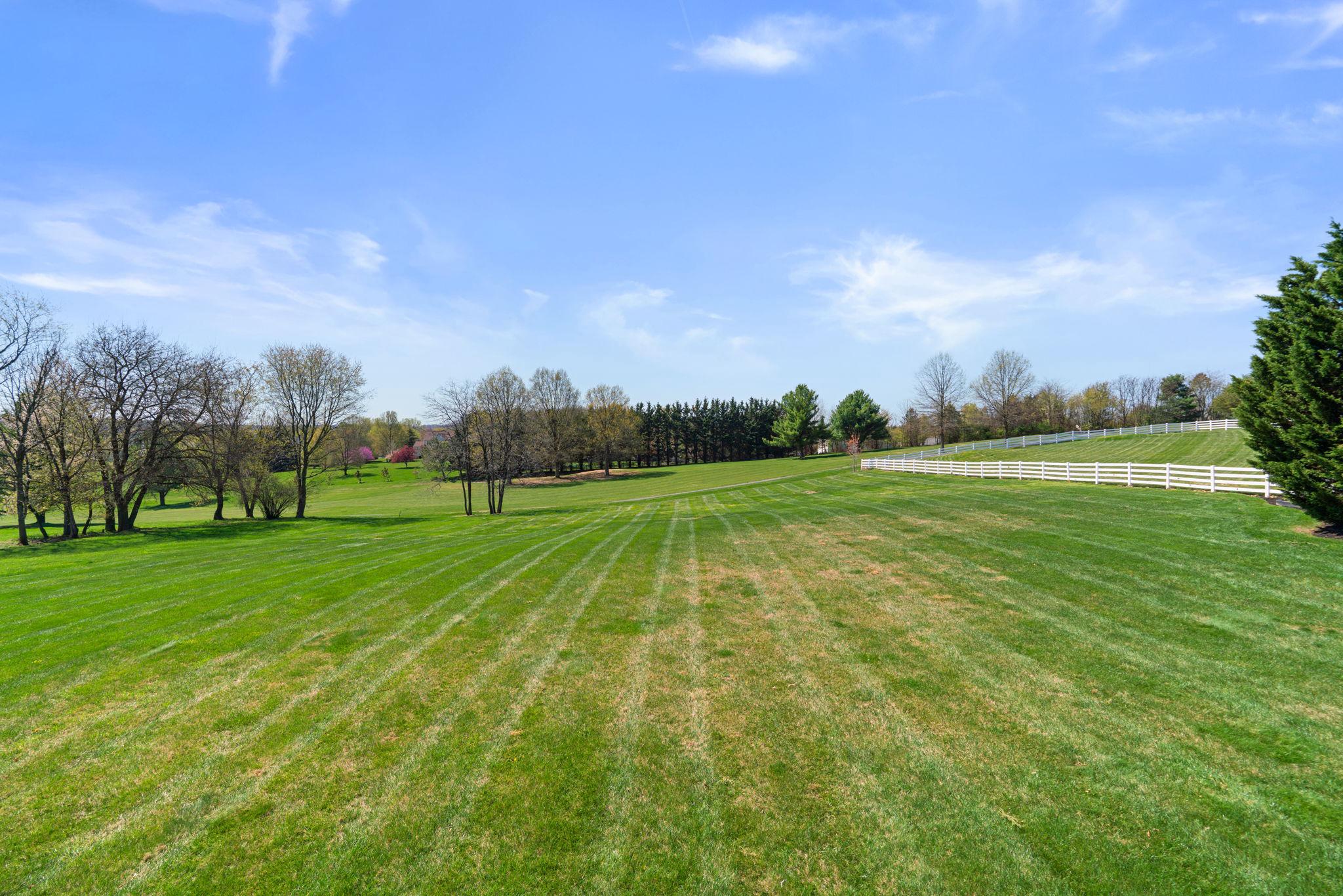 3088 Ballesteras Court Mount Airy, MD 21771 - Photo 60 of 64 a view of a golf course with a garden