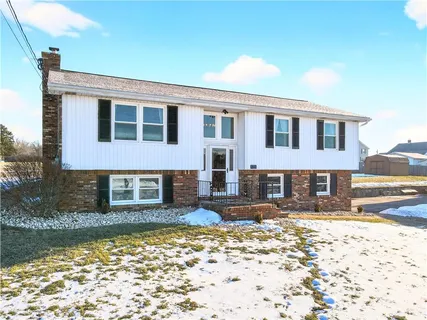 a view of a room with lots of stuff and furniture