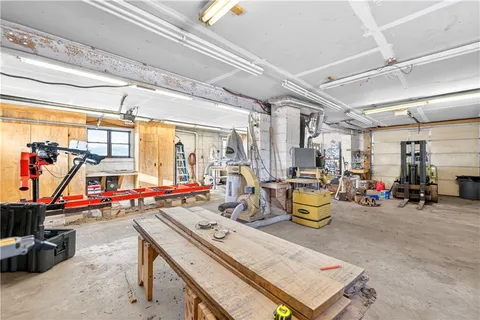 a kitchen with stainless steel appliances white cabinets and a refrigerator