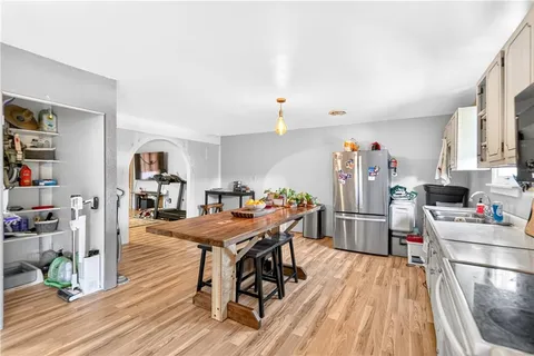 a living room with furniture a rug and a chandelier