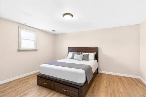 a view of a house with a yard and covered with snow