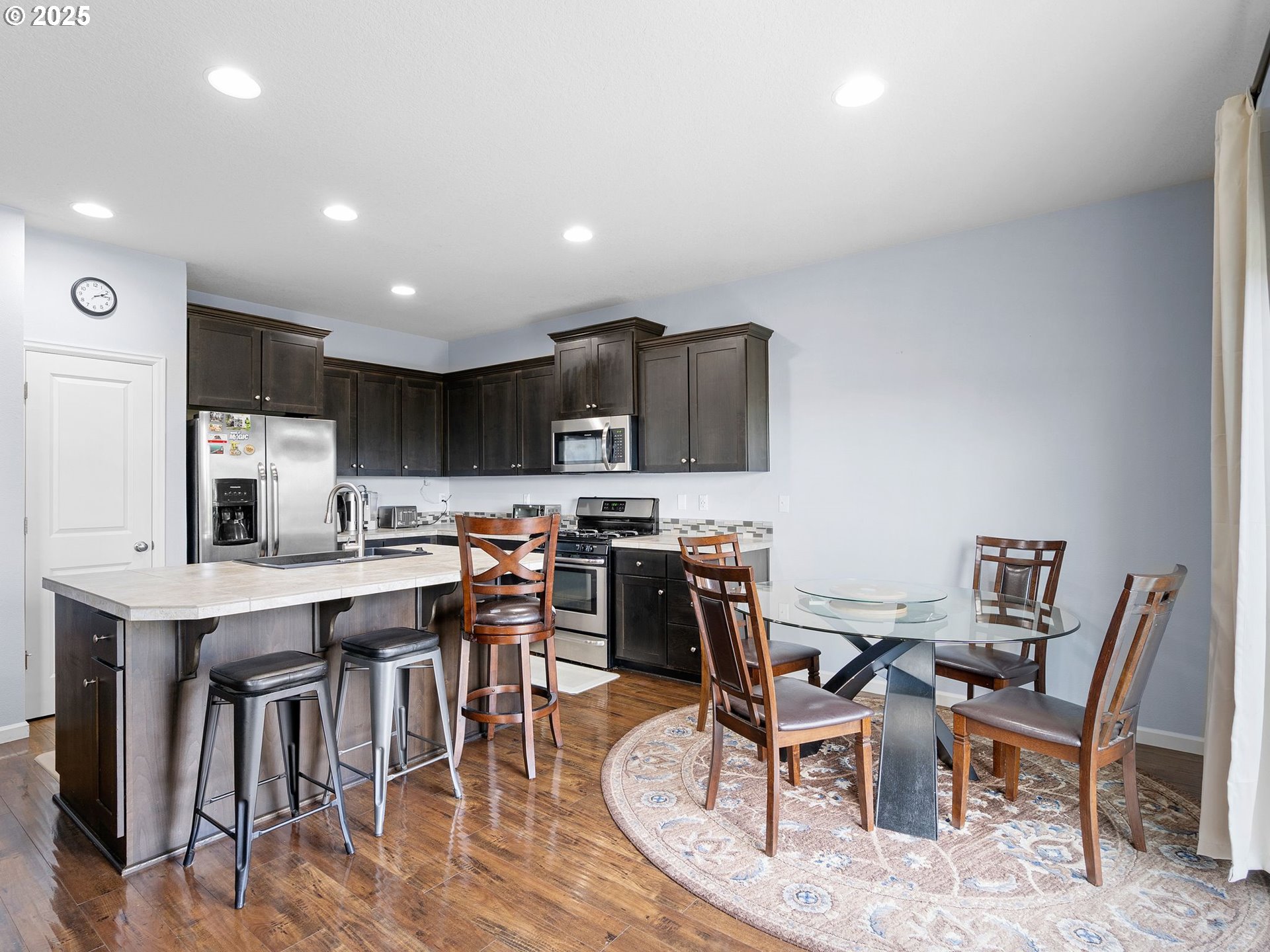 51350 Southwest Randstad Street Scappoose, OR 97056 - Photo 13 of 43 a view of kitchen with cabinets table and chairs