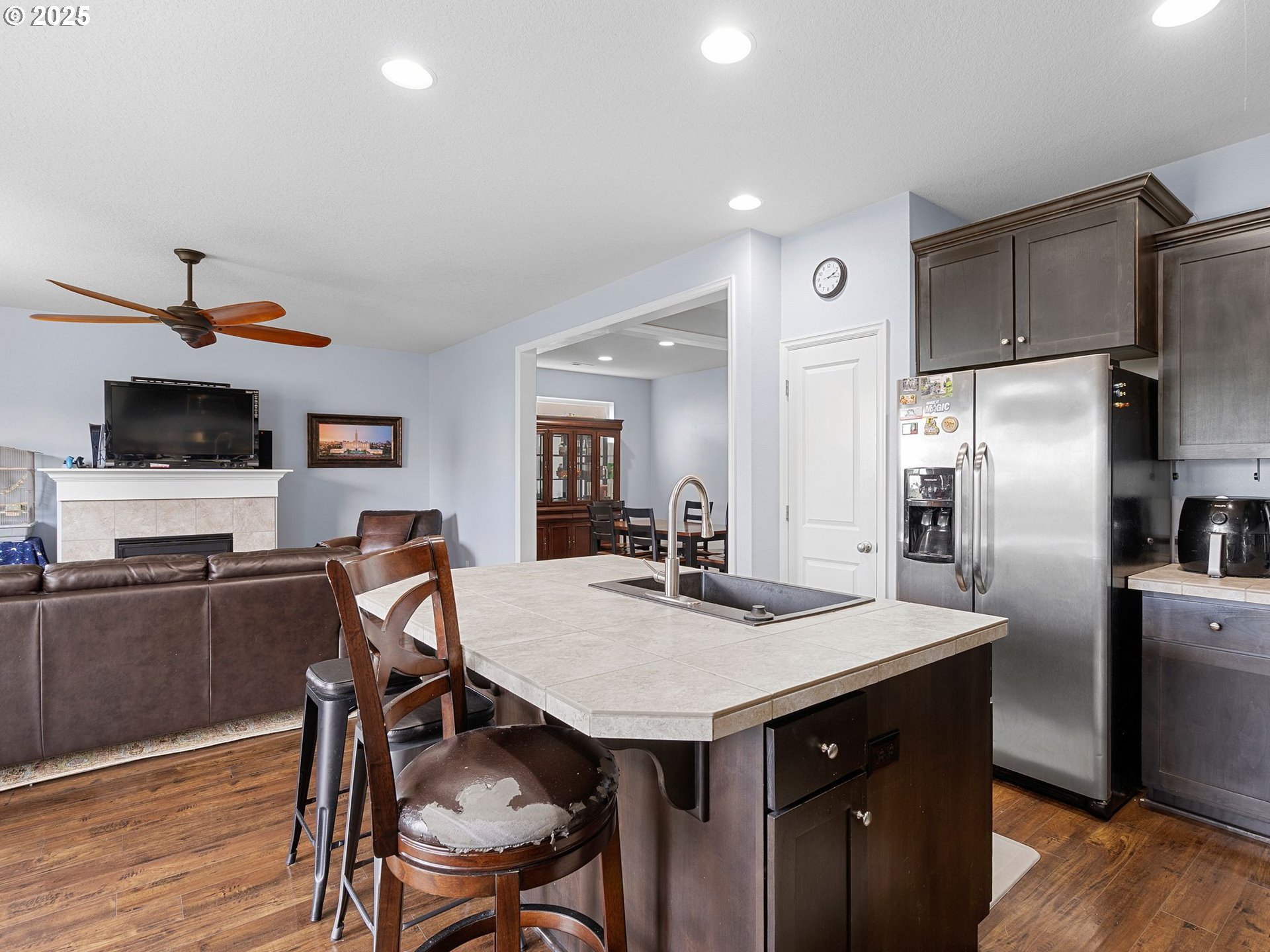 51350 Southwest Randstad Street Scappoose, OR 97056 - Photo 14 of 43 a kitchen with stainless steel appliances a table chairs and refrigerator