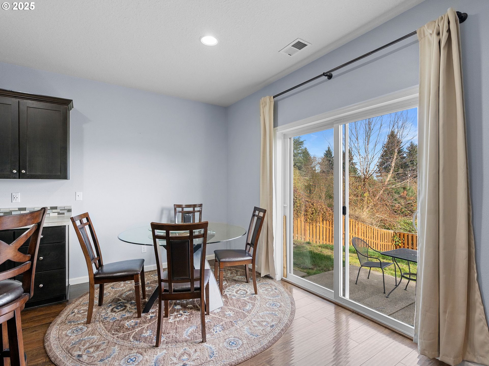 51350 Southwest Randstad Street Scappoose, OR 97056 - Photo 17 of 43 a dining room with furniture and wooden floor