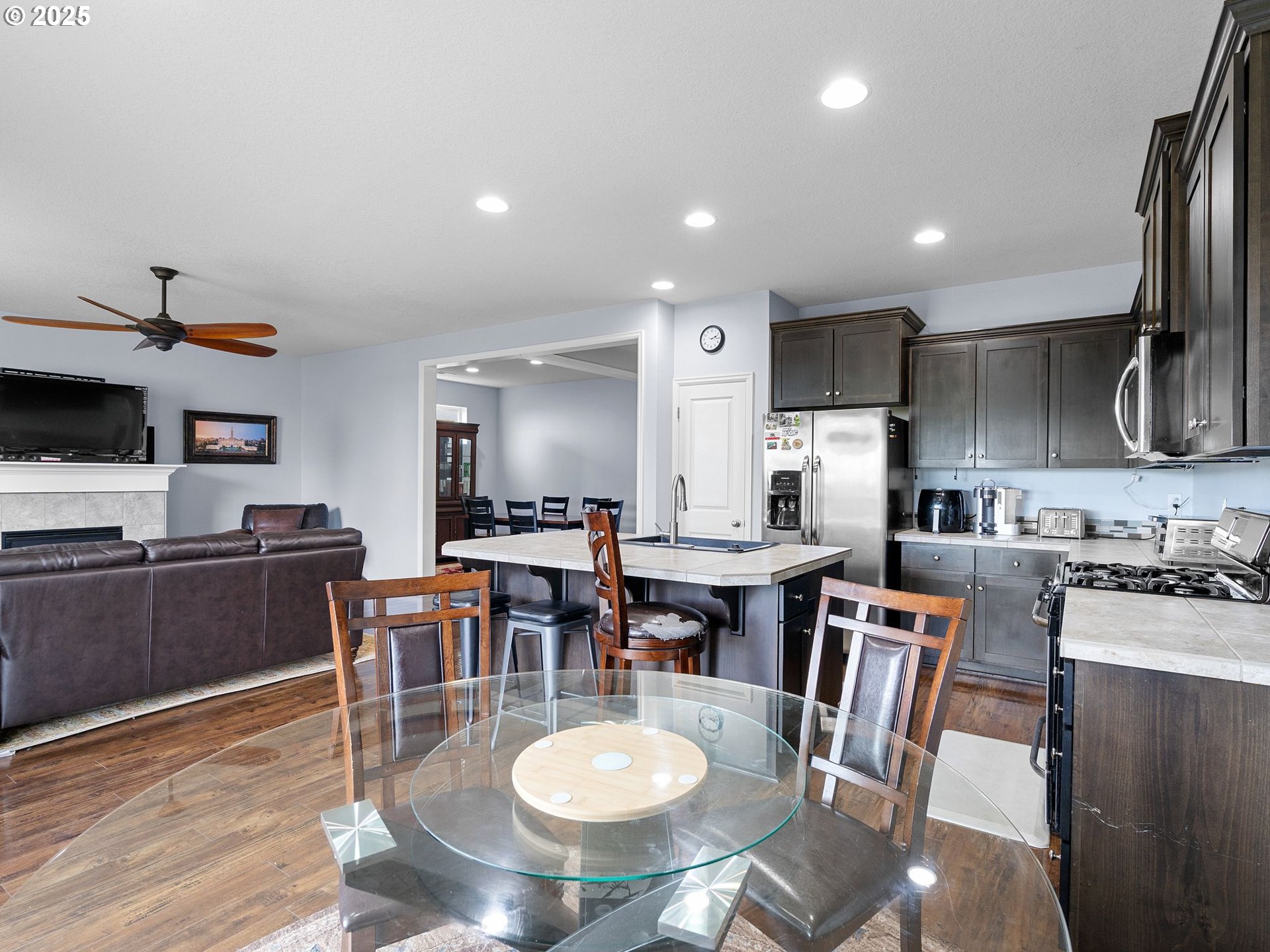 51350 Southwest Randstad Street Scappoose, OR 97056 - Photo 18 of 43 a view of a dining room with furniture a kitchen and chandelier