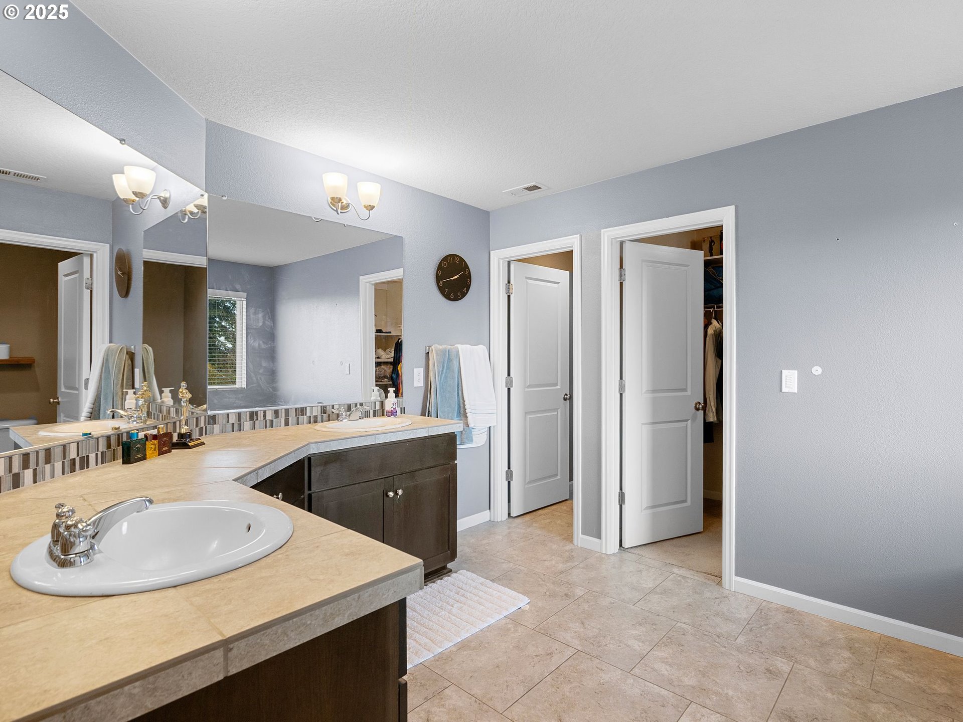 51350 Southwest Randstad Street Scappoose, OR 97056 - Photo 32 of 43 a bathroom with a sink double vanity and a mirror