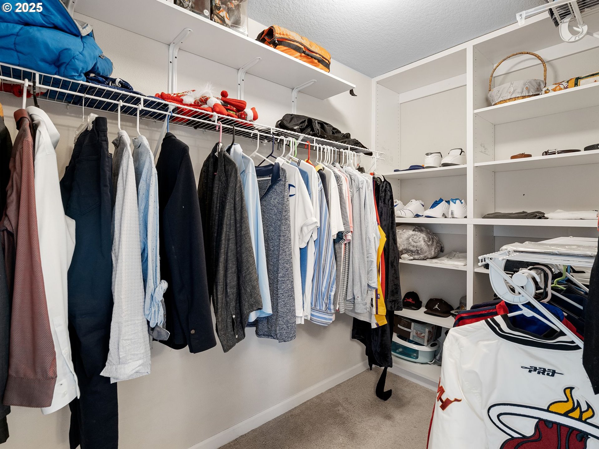51350 Southwest Randstad Street Scappoose, OR 97056 - Photo 35 of 43 a view of walk in closet with clothes and shoes