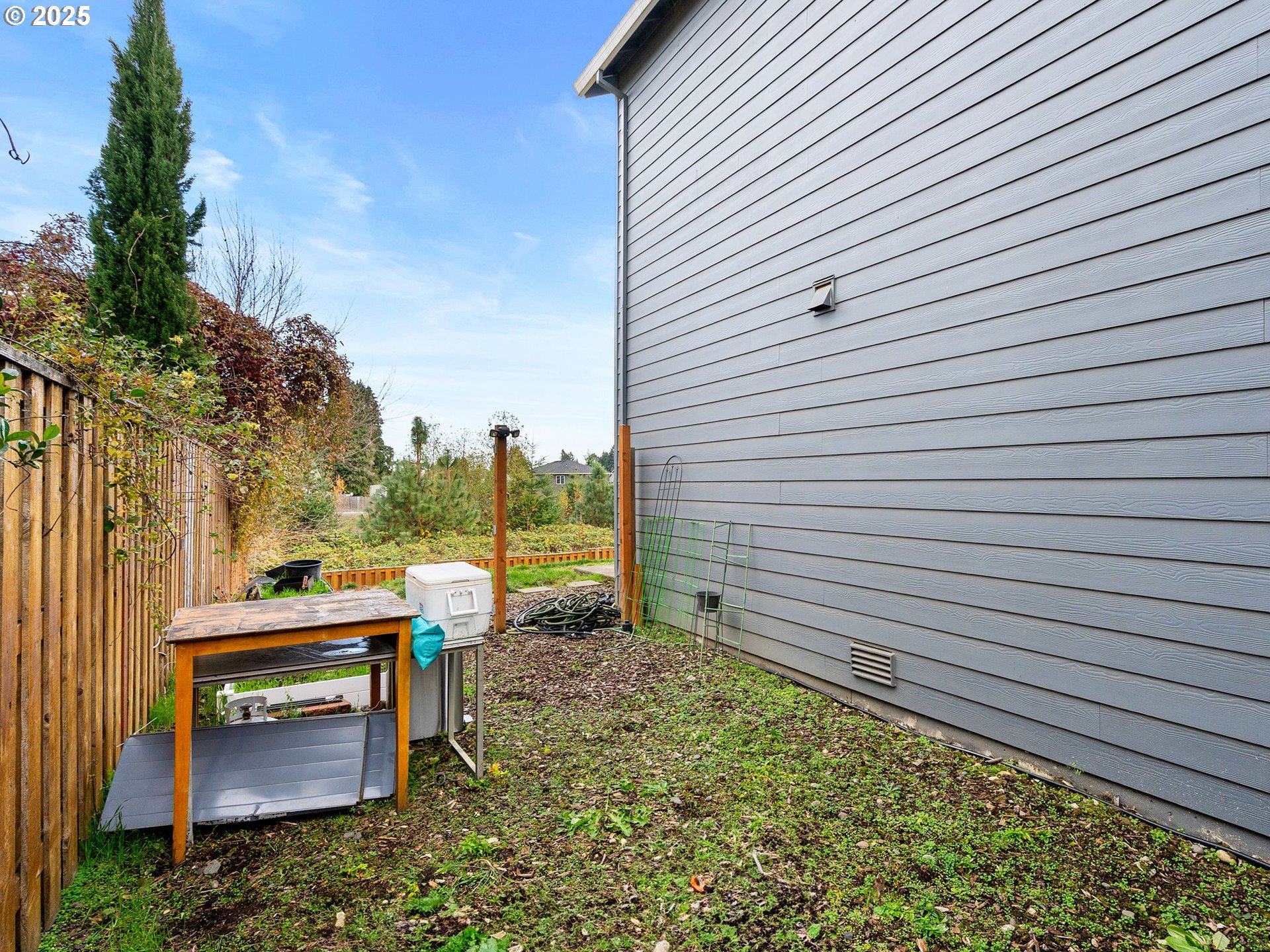 51350 Southwest Randstad Street Scappoose, OR 97056 - Photo 42 of 43 a backyard of a house with barbeque oven