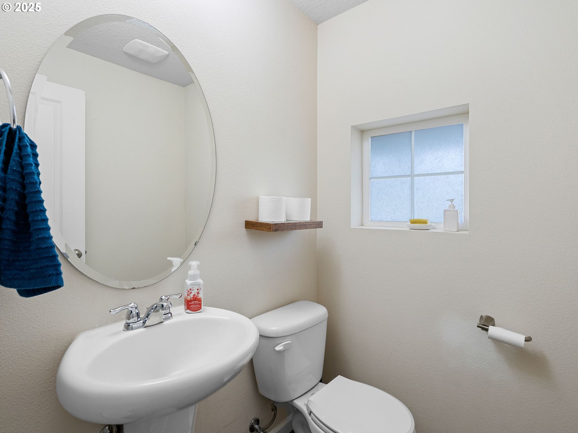 51350 Southwest Randstad Street Scappoose, OR 97056 - Photo 7 of 43 a bathroom with a sink mirror and toilet