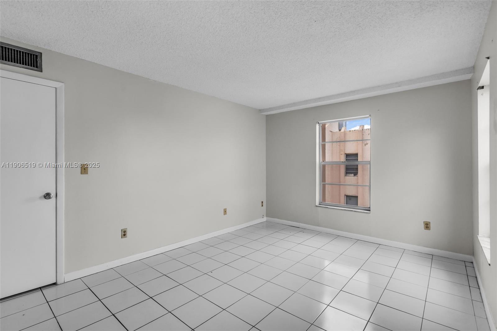 7345 West 4th Avenue, Unit 402 Hialeah, FL 33014 - Photo 15 of 22 a view of an empty room with window