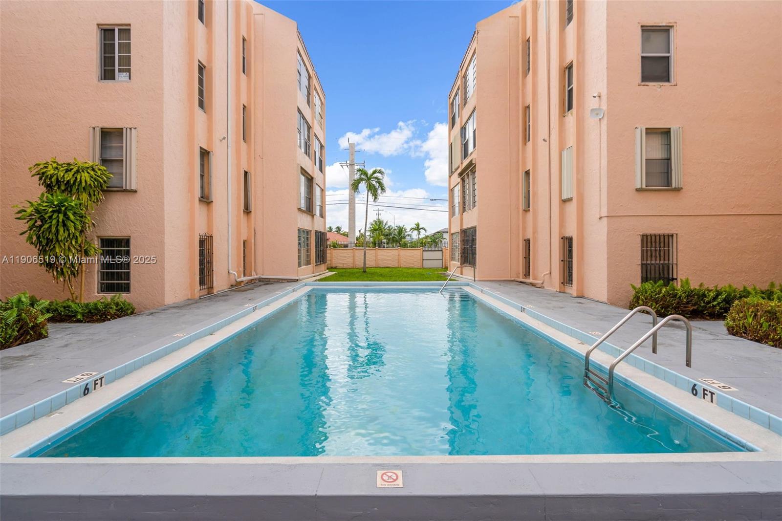 7345 West 4th Avenue, Unit 402 Hialeah, FL 33014 - Photo 19 of 22 a view of swimming pool with a yard