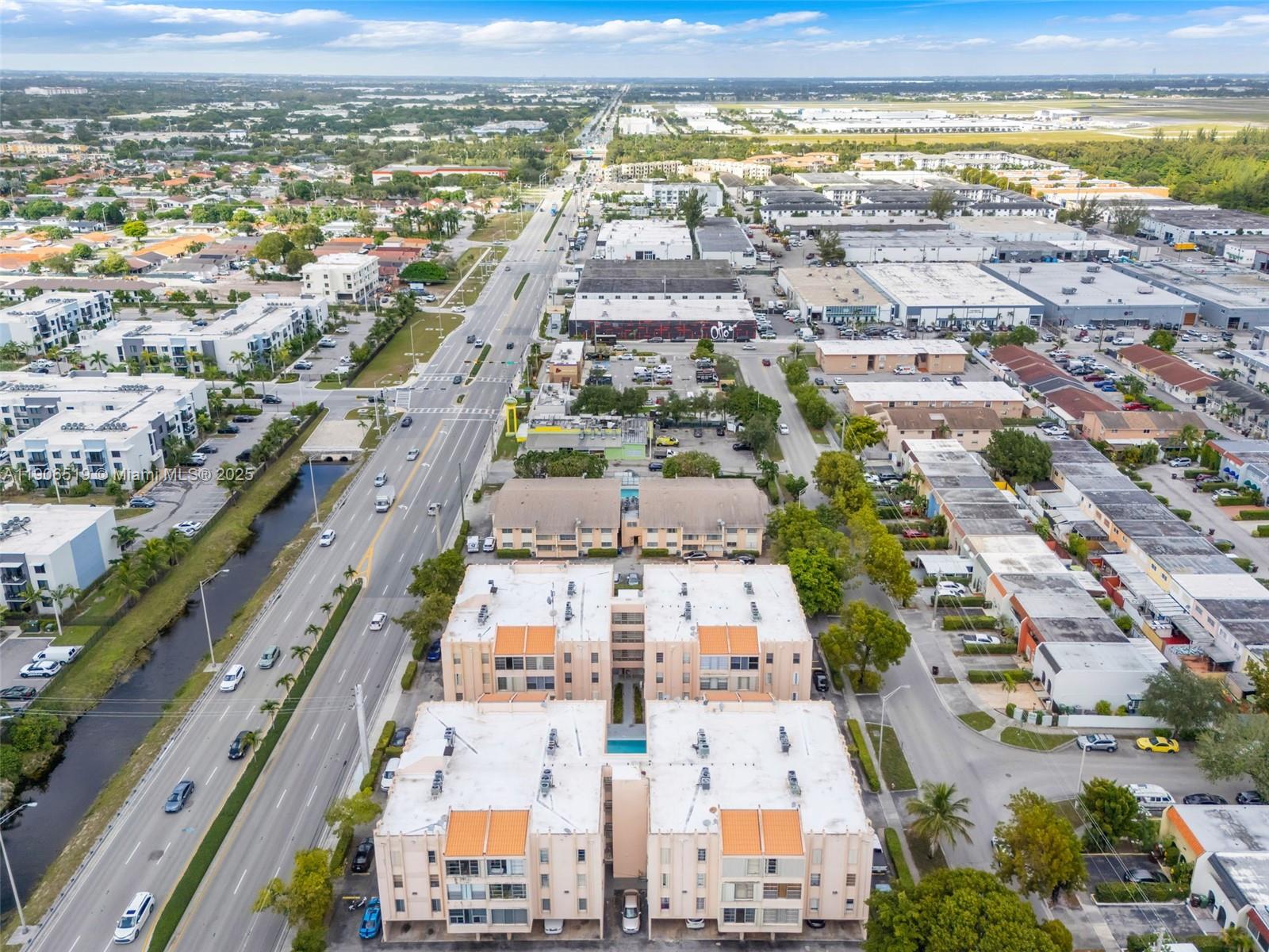 7345 West 4th Avenue, Unit 402 Hialeah, FL 33014 - Photo 21 of 22 an aerial view of residential building and lake