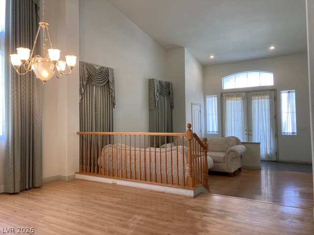 141 Rancho Maria Street Las Vegas, NV 89148 - Photo 6 of 30 High ceilings and warm wood floors define this welcoming split-level living area.