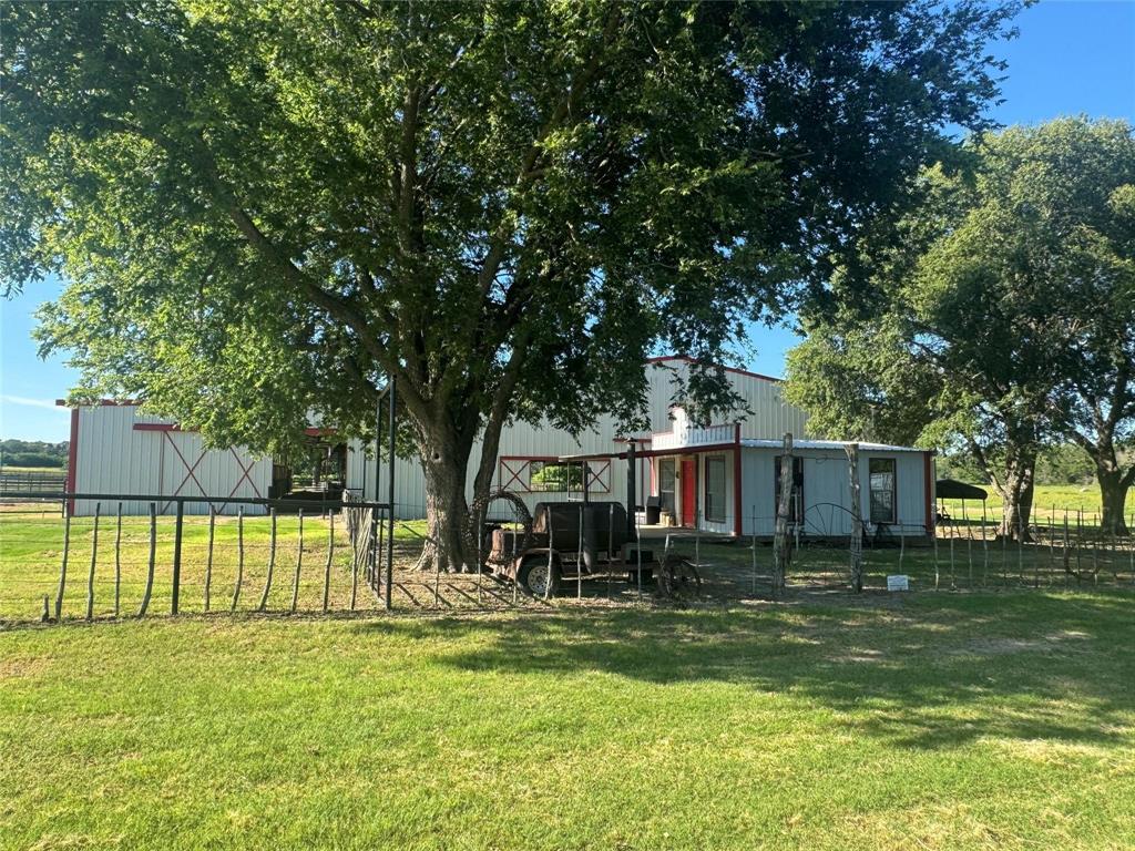 377 Private Road 3249, Unit ARENA Decatur, TX 76234 - Photo 5 of 40 a view of a house with a big yard