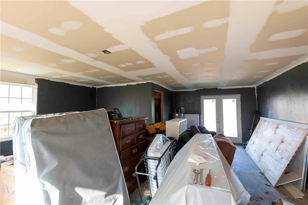 946 Hightower Loop Road Ranger, GA 30734 - Photo 19 of 22 a living room with furniture a large window and flat screen tv