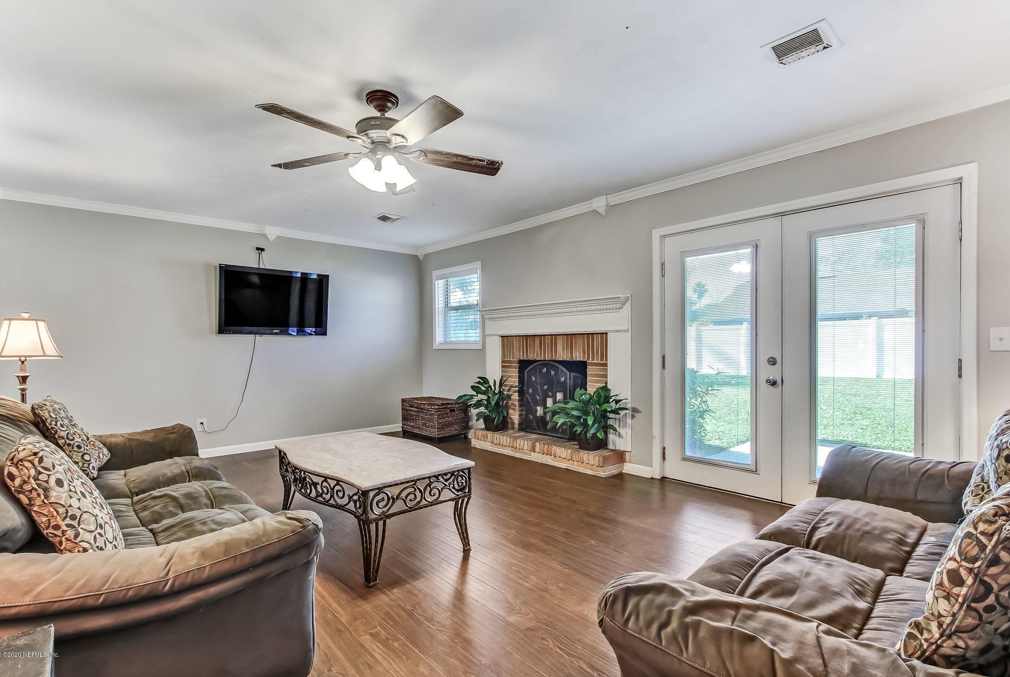 4006 Eunice Road Jacksonville, FL 32250 - Photo 11 of 30 a living room with furniture and a fireplace