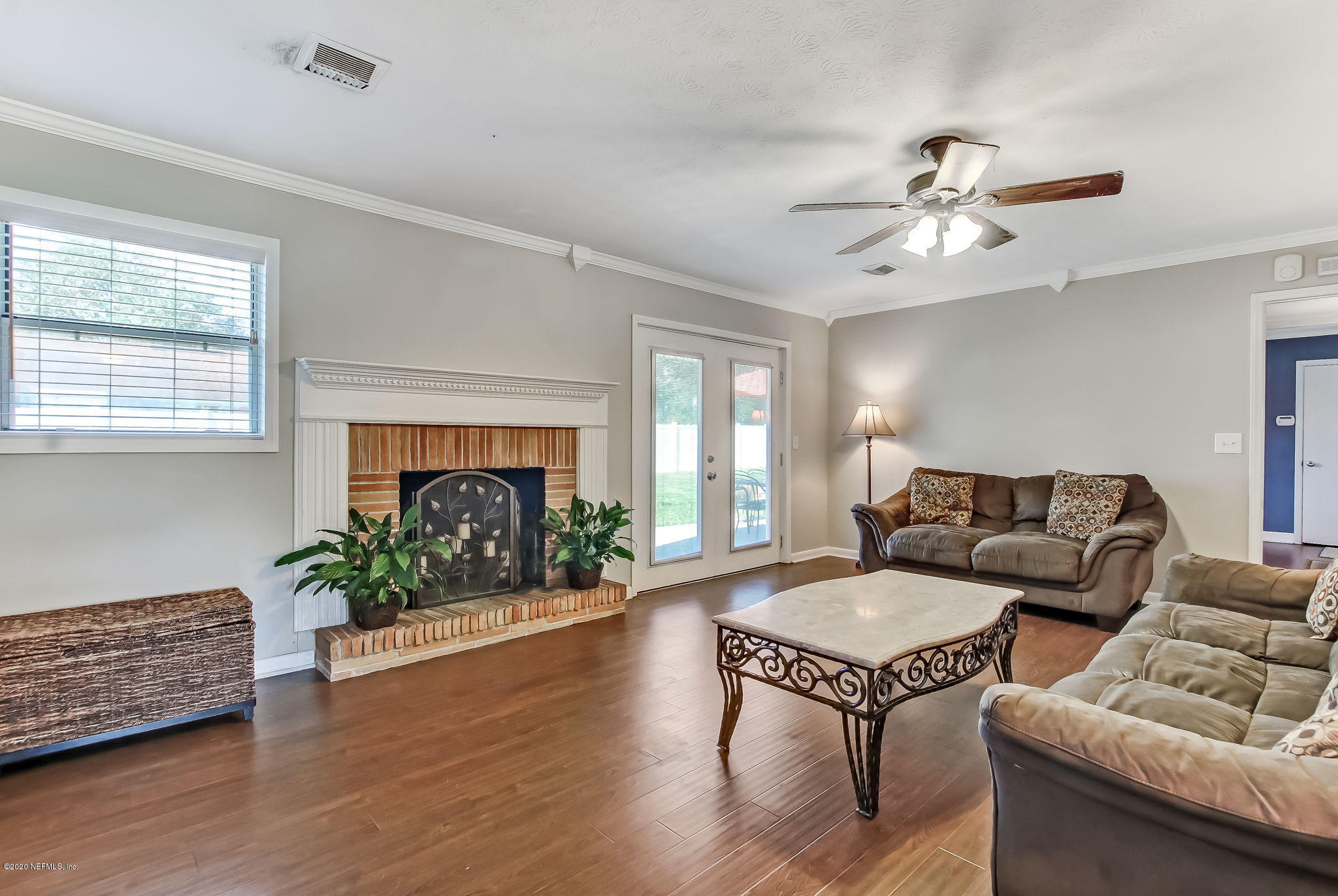 4006 Eunice Road Jacksonville, FL 32250 - Photo 12 of 30 a living room with furniture fireplace and window