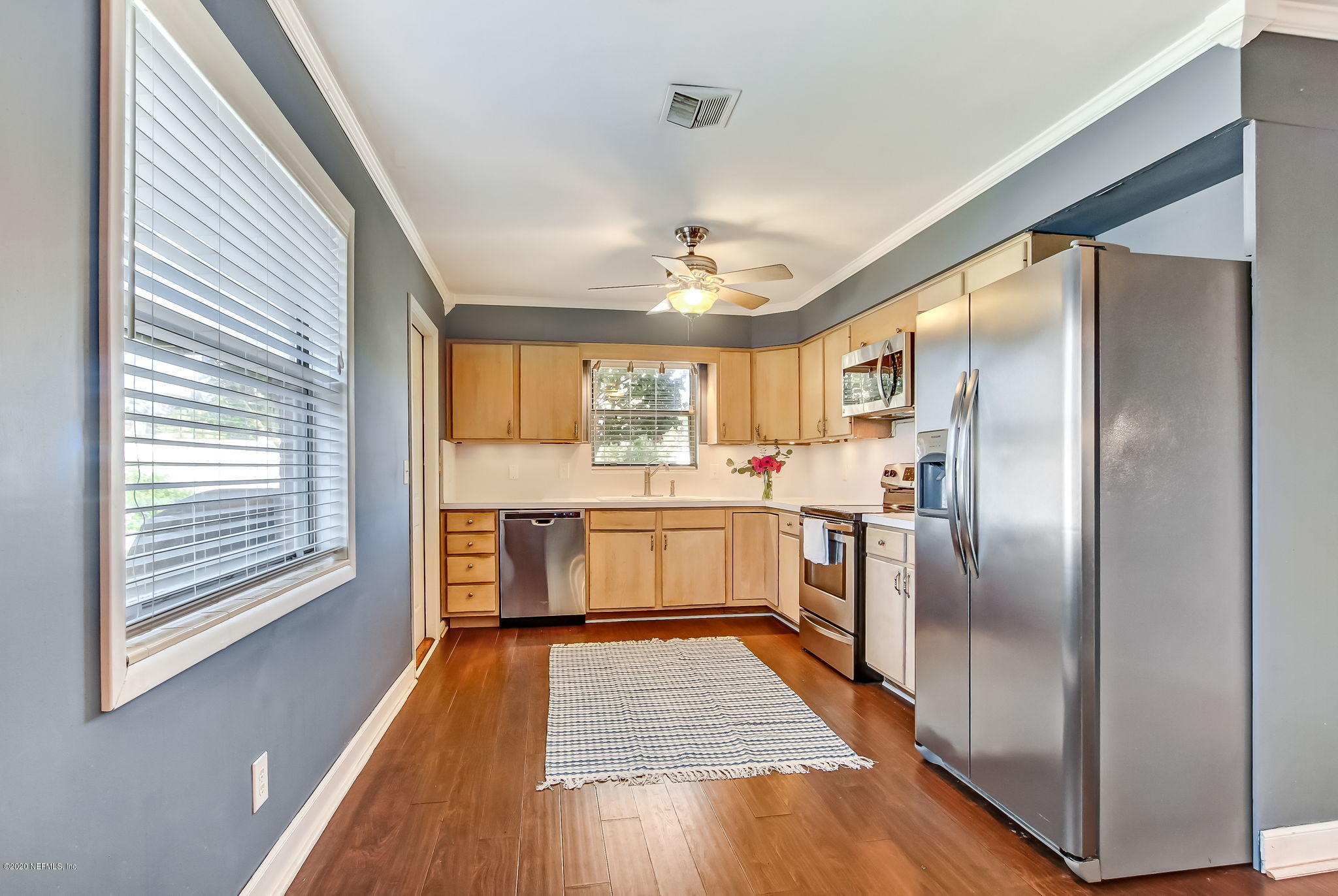 4006 Eunice Road Jacksonville, FL 32250 - Photo 16 of 30 a kitchen with stainless steel appliances a refrigerator and a stove